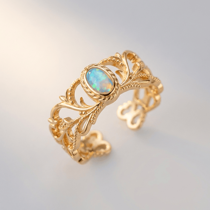 ANELLO CON ALI CELESTIALI IN OPALLO ROSA - (REGOLABILE)