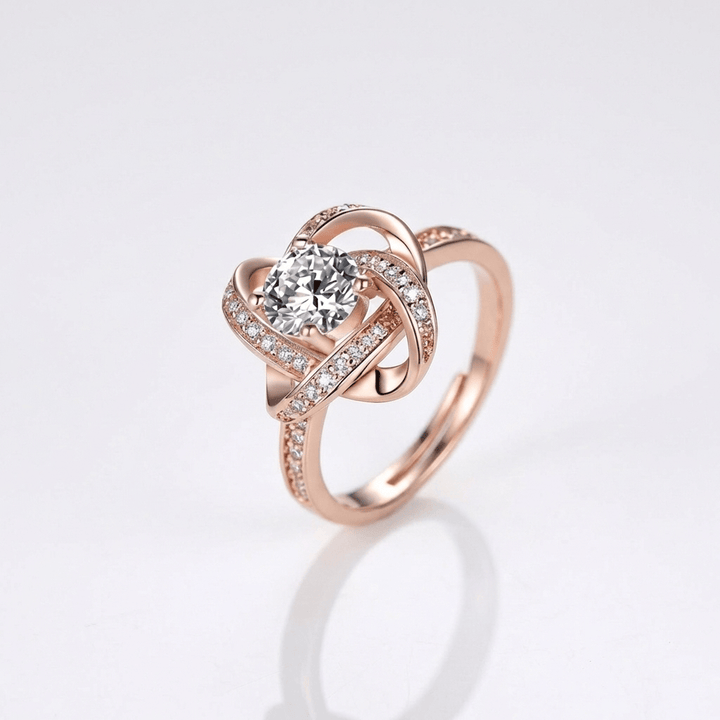 ANELLO INTRECCIATO IN ZIRCONE ROSA - (REGOLABILE)