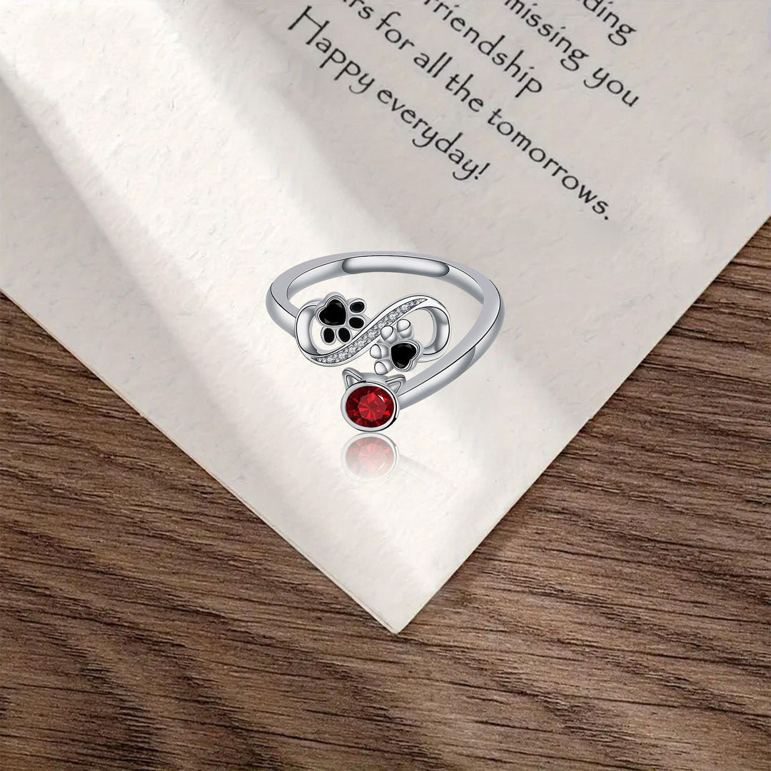Anello Regolabile con Impronta Nera e Gemma Rossa