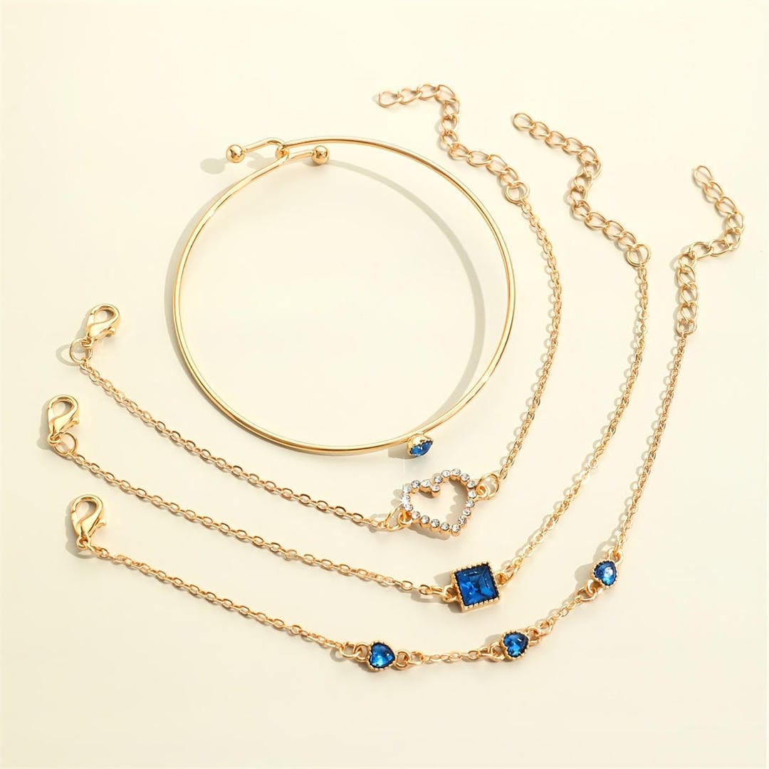 Set di Bracciali Cuori Dorati in Pietra Blu