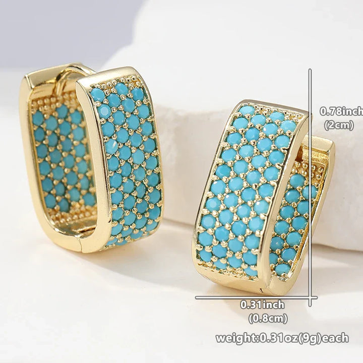 Orecchini Huggie in Oro con Pavé Turchese