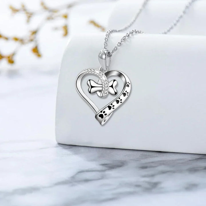 Set di gioielli in 2 pezzi con ciondoli a forma di zampa, cuore e osso
