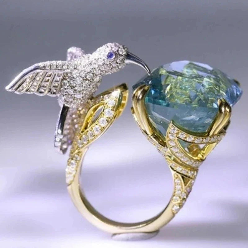 Anello Regolabile Colore Acquamarina con Colibrì – Placcato Oro