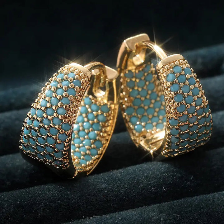 Orecchini a cerchio con perline turchesi tono oro | Oro