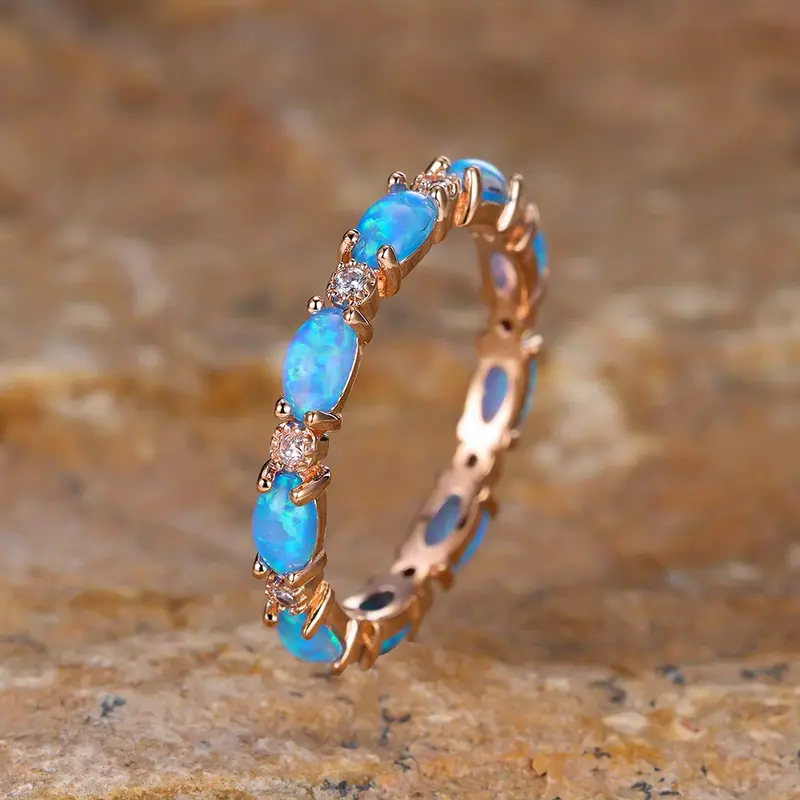 Anello color oro con Opale Blu